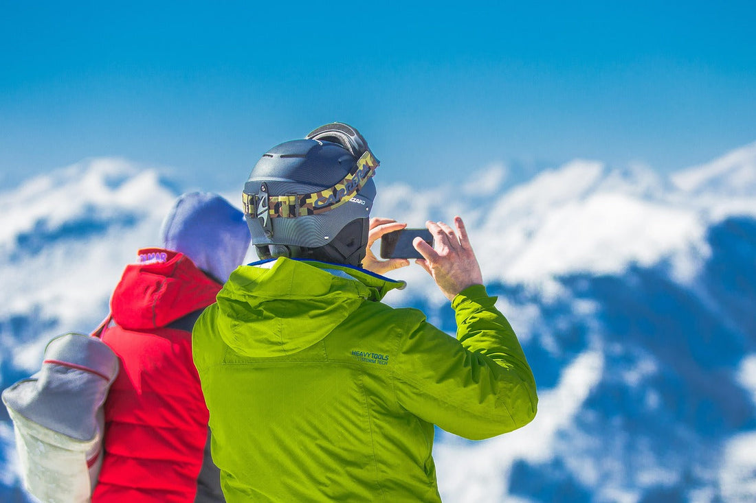 Skiers on mountain top taking a photo