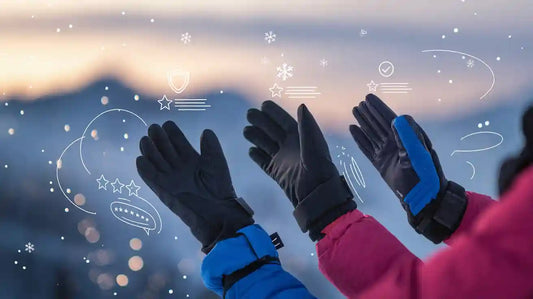 Two people wearing black and blue ski gloves against a snowy background.