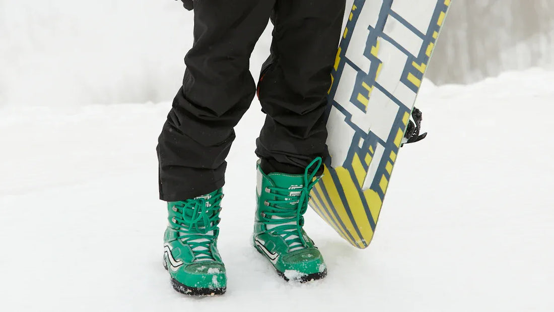 Men skiing in baggy white and black snow pants.