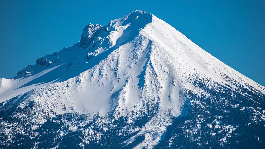 Snow-capped mountain peak ideal for summer skiing