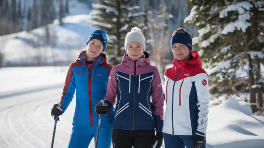Group of women in colorful cross-country ski jackets in snowy landscape